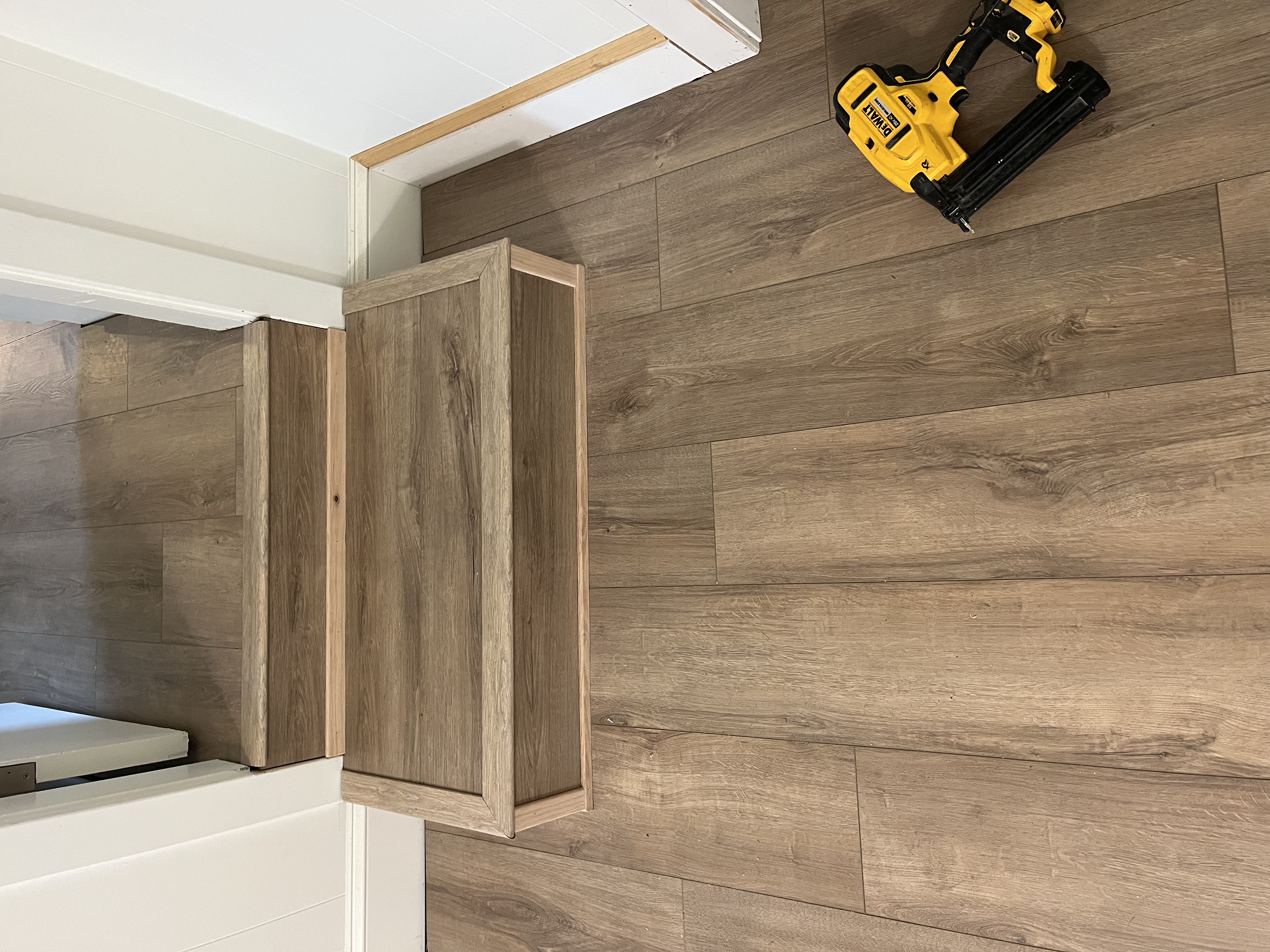 Vinyl plank flooring installed cleanly over a stepped transition